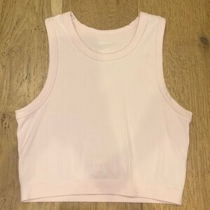 Light pink tank top; only worn once; a small red stain towards bottom of top
